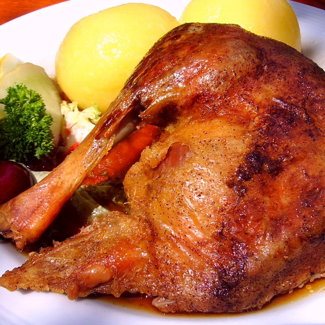 Cosce d'oca brasate al forno