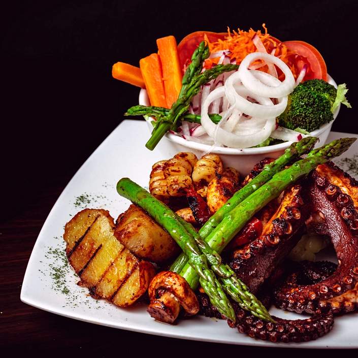 El casero pulpo a la brasa con arroz