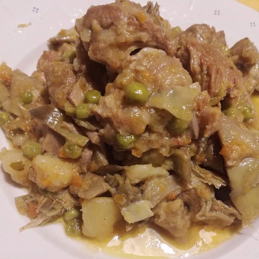 Fricassea di agnello con carciofi e piselli